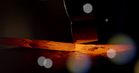 Close-up view of a metal cutting machine cutting a piece of metal.