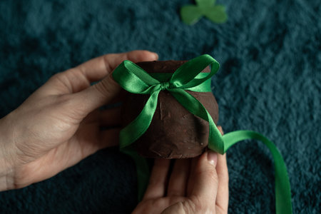 Hands holding a pitcher of leprechaun goldの写真素材