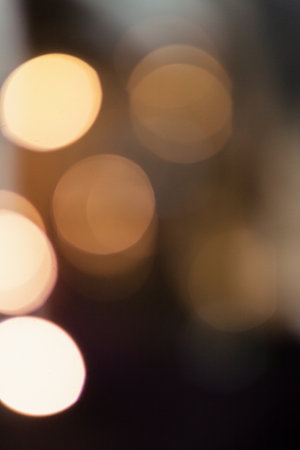 Blurred bokeh of glowing garland for backgroundの写真素材