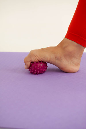 Foot hugging gymnastic ball with toesの写真素材
