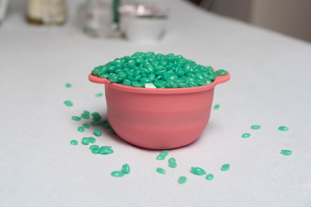 Wax granules for depilation are poured