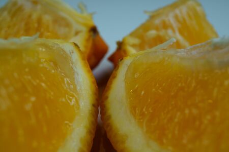 Macro photo of orange slice on white background