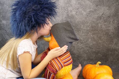 young girl with pumpkin. Friendship concept with emotions, no friends,nothing to do, lovely, in love, alone. for postcards, with copy spaceの写真素材