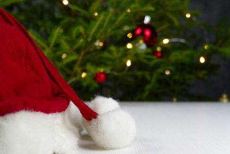 Beautiful Christmas composition. Gift boxes and christmas decor with christmas tree on background. Xmas backdrop for your greeting card with space for text.の写真素材