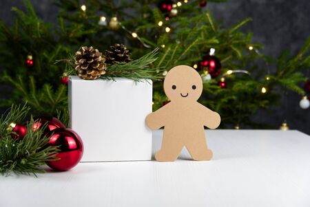 Beautiful Christmas composition. Gift boxes and christmas decor with christmas tree on background. Xmas backdrop for your greeting card with space for text.の写真素材