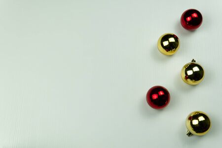 fir branches with cones and Christmas toys on a white wooden background. Copy Spaceの写真素材