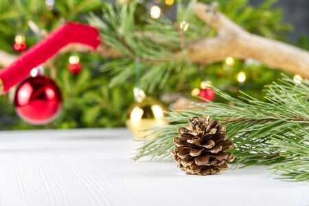 Beautiful Christmas composition with Christmas ornament. Gift boxes and christmas decor with christmas tree on background. Xmas backdrop for your greeting card with space for text.の写真素材