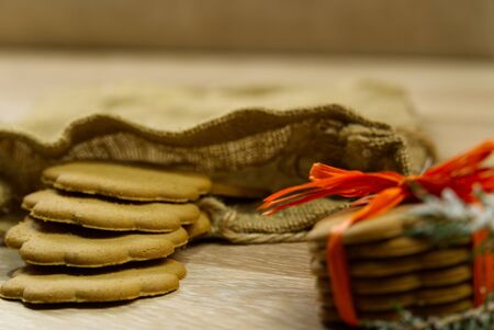 Christmas cookie or Gingerbread cookies on a wooden background.の写真素材