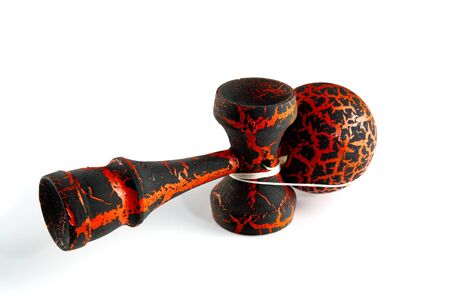 Kendama japanese wooden toy on isolated on white. Wood toy in black and orange color, dragon colorの写真素材