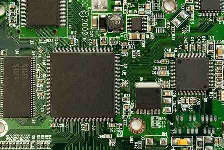 Electronic board can be used as background . Close up of a printed green computer circuit board.
