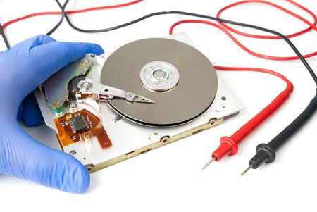 Hard disk repair concept. Hdd - hard disk drive. The hard drive is designed to store data of all mankind, so timely monitoring is very important.の写真素材