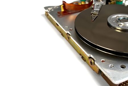 Close up inside of Hard disk drive - HDD . Detail of writing reading head on acuator arm and axis,...