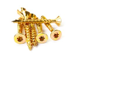 Gold torx screw isolated on white. Yellow zinc chipboard screw Torx, , full thread close upの写真素材
