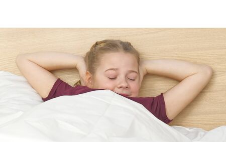 Beautiful young girl stretching in the morning at bedroom.