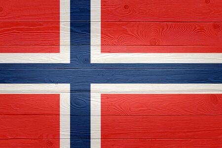 Norway flag painted on old wood plank background. Brushed natural light knotted wooden board texture. Wooden texture background flag of Norway.の写真素材