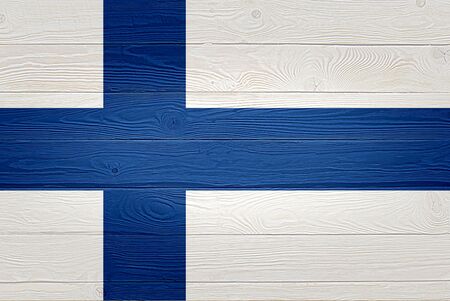 Finland flag painted on old wood plank background. Brushed natural light knotted wooden planks board texture. Wooden texture background flag of Finlandの写真素材