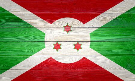 Burundi flag painted on old wood plank background. Brushed natural light knotted wooden board texture. Wooden texture background flag of Burundi.の写真素材