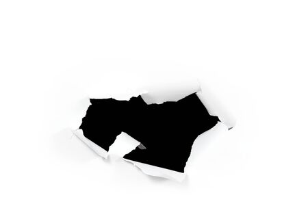 A black hole in white paper. Broken white paper. hole to nowhereの写真素材
