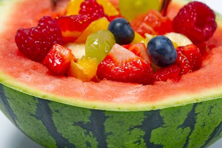 Watermelon filled with fresh fruit salad. summer fresh fruits salad close-upの写真素材