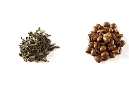 Pile of coffee beans and dry green tea leaves isolated on white background. closeupの写真素材