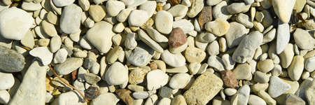 Baltick Sea beach. Natural small pebbles on the rocky seashore, panorama. can be usedas texture or...