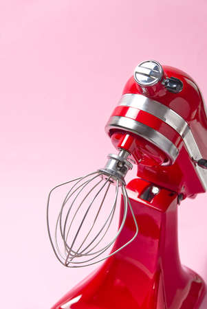 Red kitchen mixer on a pink background.の写真素材