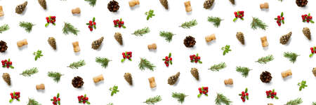 christmas background with pine cone, wine cork, pine twig and lingonberry. christmas background on white backdropの写真素材