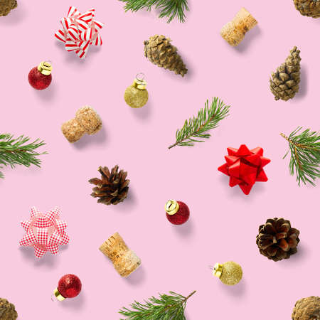 Seamless regular creative Christmas pattern with New Year decorations on pink background. xmas Modern Seamless pattern made from christmas decorations. Photo quality pattern for fabric, prints, wallpapers, banners or creative design works.の写真素材
