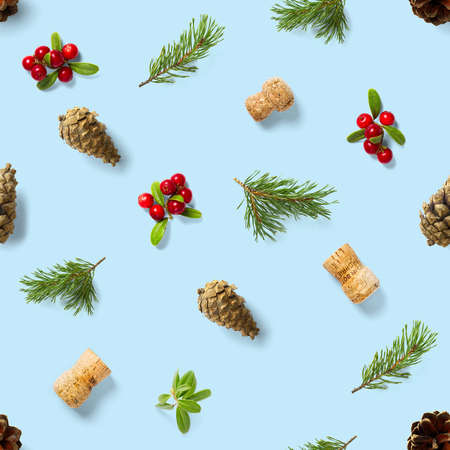christmas seamless patterns with Pine cones wine cork and lingonberry. pattern christmas seamless on a blue backdrop. Realistic photo collage. Print for paper, fabric, wallpaper.の写真素材