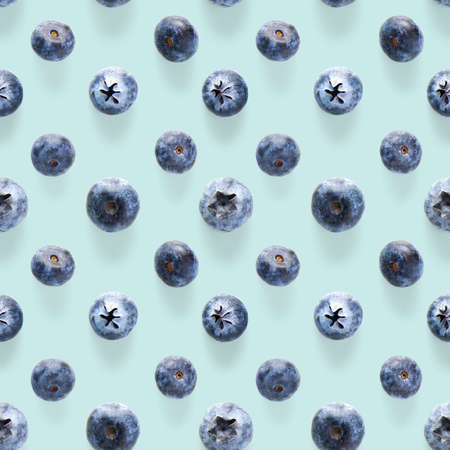 Trendy seamless pattern of blueberries. Blueberry pattern isolated on blue background. Blueberry...