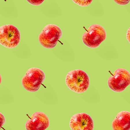 Seamless pattern with ripe apples. Apple seamless pattern on green background. Tropical fruit abstract background.の写真素材