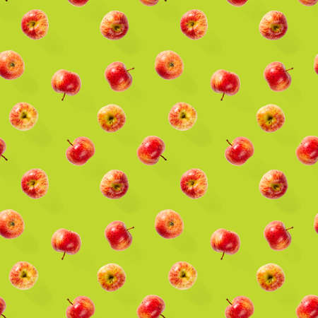 Seamless pattern with ripe apples. Apple seamless pattern on green background. Tropical fruit abstract background.の写真素材