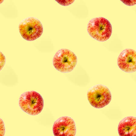 Seamless pattern with ripe apples. Apple seamless pattern on yellow background. Tropical fruit...