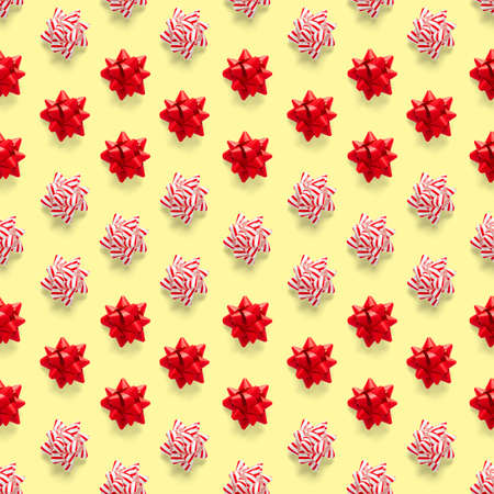 Seamless regular creative Christmas pattern with New Year decorations on yellow background. xmas...