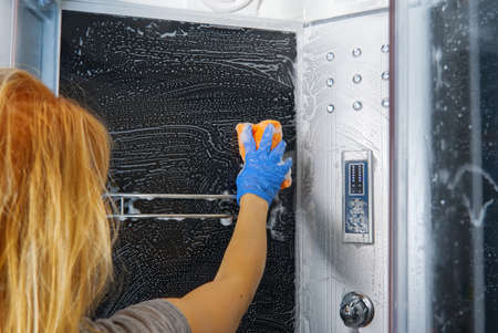 Cleaning of shower steam cabins from Calcium deposits. Cleaning in the bathroom.の写真素材