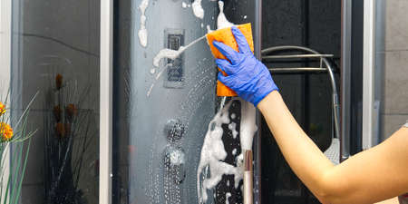 Cleaning of shower steam cabins from Calcium deposits. Cleaning in the bathroom.の写真素材