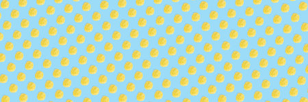 background made from Potato chips on light blue background flat lay. potato snack chips isolated...