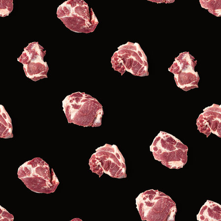 Seamless Pattern with raw pork meat slices on black background, food patternの写真素材
