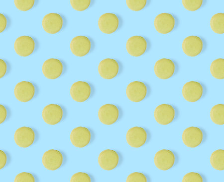 macarons seamless pattern. macarons isolated on blue background.の写真素材