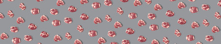 background with raw pork meat slices on grey background, raw food background, not pattern, banner wide shootの写真素材