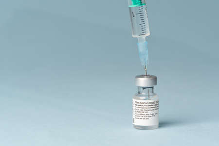 Estonia, Tallinn, 09.01.2021 Pfizer and BioNTech Covid-19 vaccine. small ampoules with vaccineのeditorial素材