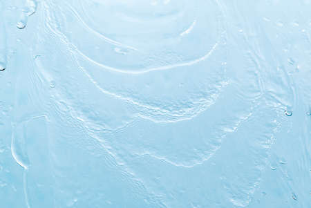 Abstract background. Drops of water on the window. water pours on a piece of clear glassの写真素材