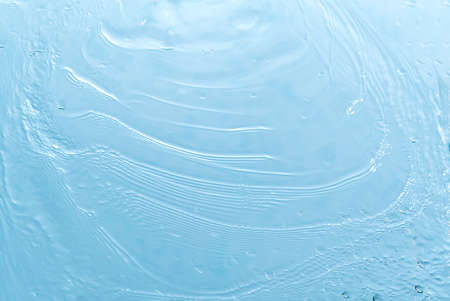 Abstract background. Drops of water on the window. water pours on a piece of clear glassの写真素材