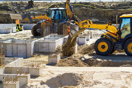 Heavy machinery at a construction site. growth of the real estate market. Construction of the...