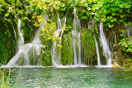 Waterfall in Plitvice Lakes national Park at summer, Croatia. Waterfalls formed by mountain lakes due to melting glaciersの写真素材