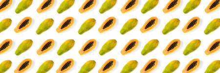 Fresh ripe papaya background on white backdrop. Modern tropical abstract background. Top view....
