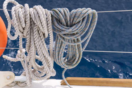Close up of striped sheet. the sheets are weighed on the yacht rails. Leer sheets on a yacht....