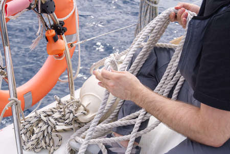 Close up of striped sheet. the sheets are weighed on the yacht rails. Leer sheets on a yacht....