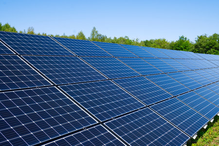 Solar power plant in summer day. Photovoltaic panels for renewable electric production. Solar panel power station landscape photographyの写真素材