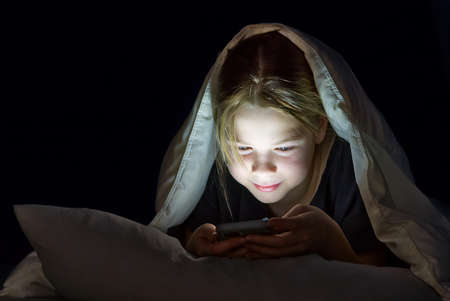 Gadget night. Romantic chat. Late home leisure. Online communication. Portrait of girl with mobile...
